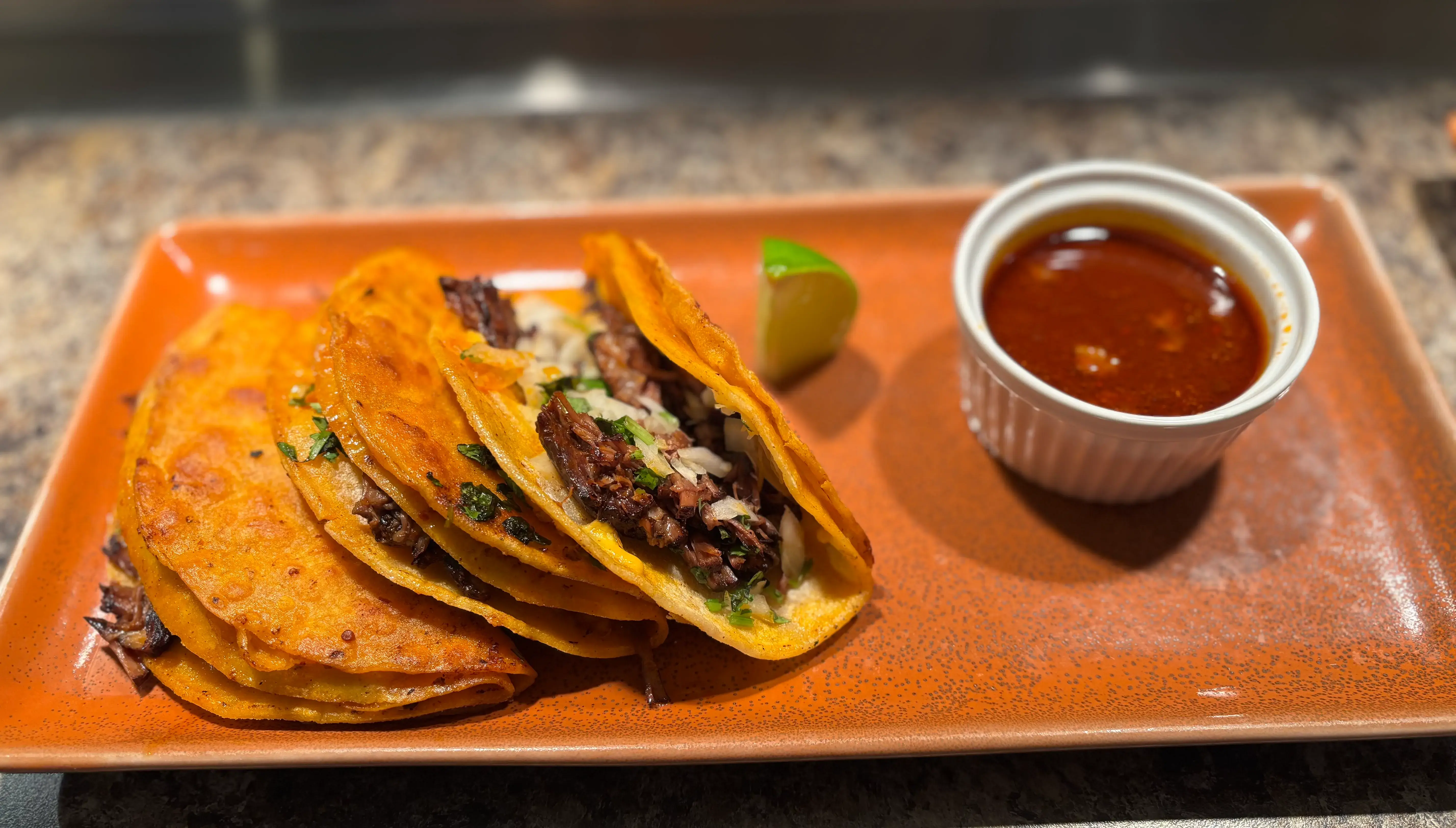 Birria Tacos Edmonton – slow-cooked shredded beef tacos with consommé at El Taco Loco Downtown